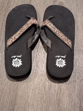 Yellow Box Women’s Black Flip Flop Sandals with Metallic Braided Straps